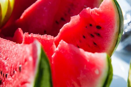 Slices of red ripe watermelon and yellow melon. Fresh fruitの写真素材