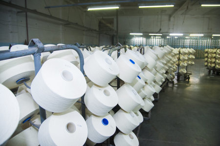Industrial fabric production line. Weaving looms at a textile factory