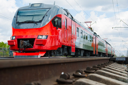 Red train in modern railway central station