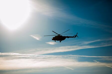 Military helicopter flying during exercise performing a military demonstrationの写真素材