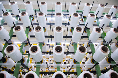 Industrial fabric production line. Weaving looms at a textile factory