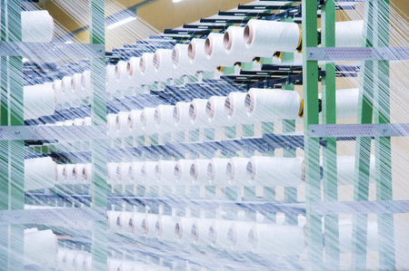 Industrial fabric production line. Weaving looms at a textile factory
