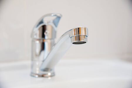 Row of modern white ceramic wash basin in public toilet or restaurant or hotel or shopping mallの写真素材