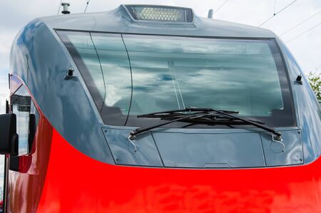 Red train in modern railway central stationの写真素材