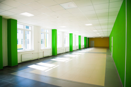 Empty clean hallway or corridor of interior classroom with furniture cabinet and door room at school
