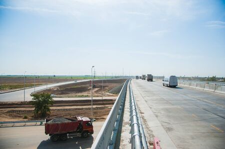 Barrier, guard rail, designed to prevent the exit of the vehicle from the curb or bridge, moving across the dividing strip.の写真素材