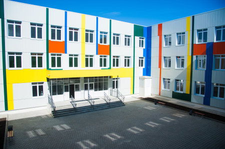 Modern school building. Sunny day, blue sky