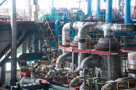The interior of a modern thermal power plant. Equipment, pipes, control center of thermal power...