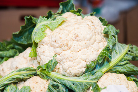 Fresh fruits and vegetables. Cauliflower is sold in the market.