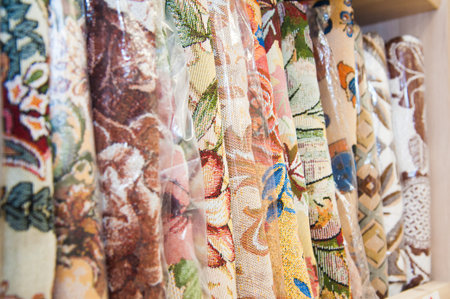 Colorful towels on the shelves in the store