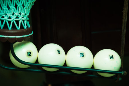 Sports game of billiards on a green cloth. Billiards white billiard balls close up
