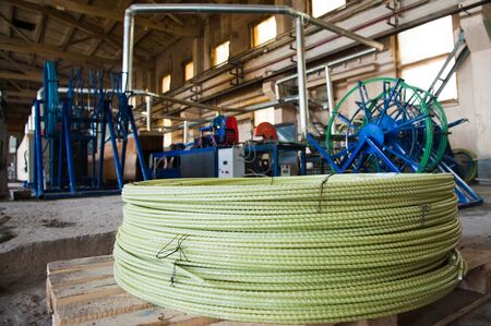 Producing fiberglass rods - manufacture of composite reinforcement, industry for constructionの写真素材