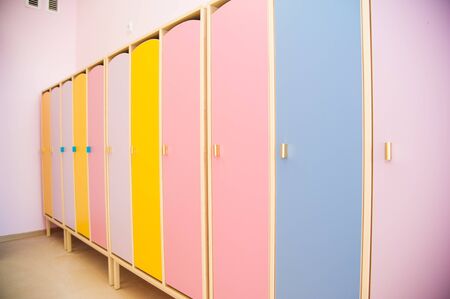 Colored doors of children wardrobes for clothes in the kindergartenの写真素材