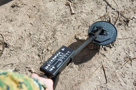 The work of a criminalist at the crime scene. Fingerprints, bullets, metal detectorの写真素材
