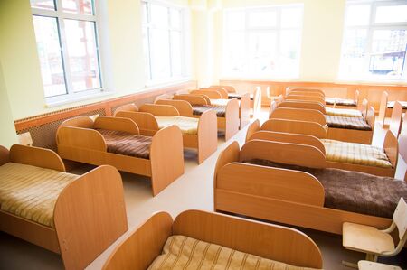 Big room with beds. Bedroom in the kindergartenの写真素材