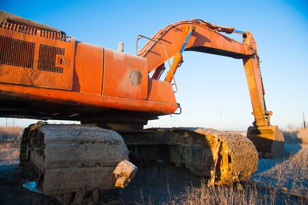 Bulldozer removes a wild dump near the city. Ecologyの写真素材