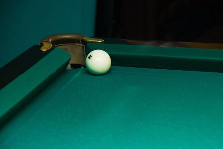 Sports game of billiards on a green cloth. Billiards white billiard balls close upの写真素材