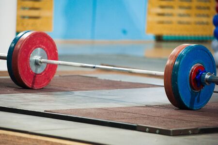 Weightlifting Barbell loaded with heavyweights ready for a class or competition to beginの写真素材