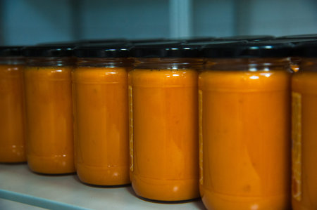 Jars full of organic honey. Production in factory