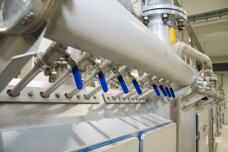 Grain processing facility inside. Industrial factory silos and equipment for food productionの写真素材