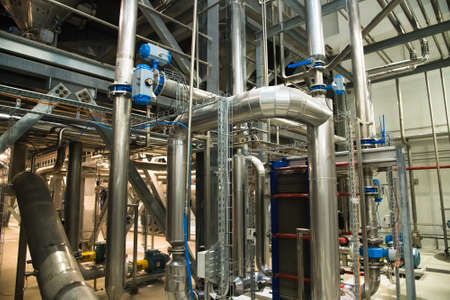 Grain processing facility inside. Industrial factory silos and equipment for food productionの写真素材