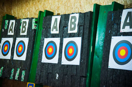 Archery. Arrows in archery target on archery rangeの写真素材