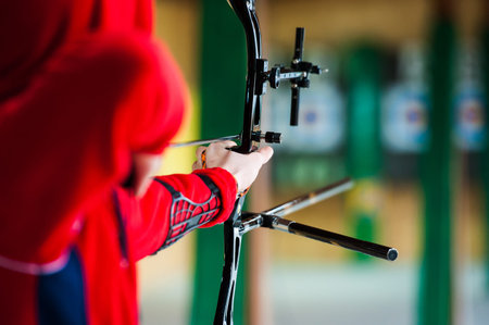 Archery. Archer exercise with the bow. Sport, recreation concept