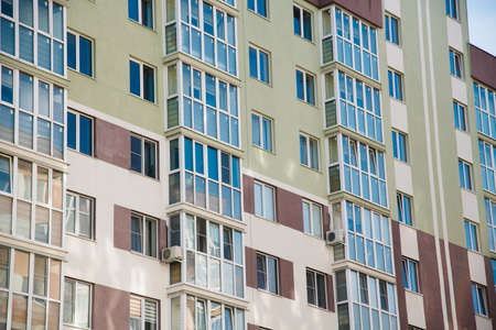 Brand new apartment building against the blue summer skyの写真素材