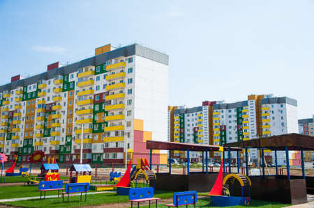 Brand new apartment building against the blue summer skyの写真素材