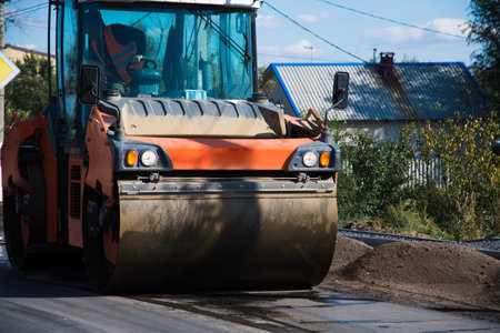 Repair of the old and construction of a new asphalt road. The excavators, graders and road rollers...