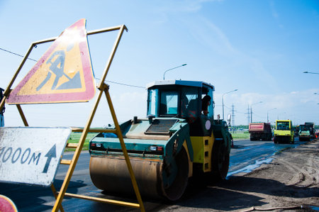 Repair of the old and construction of a new asphalt road. The excavators, graders and road rollers...
