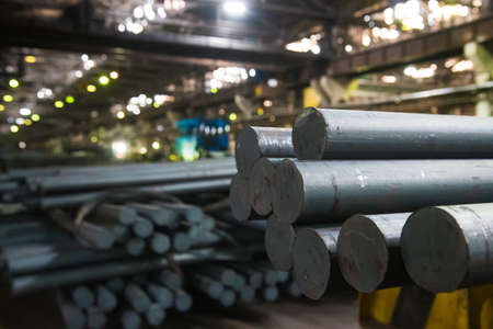 Metal structures and buildings of the old metallurgical plant inside and outside. The process of melting metal. Steelworker at work. Products of the metallurgical enterprise.の写真素材