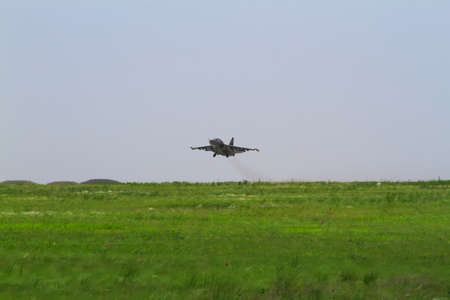 Military fighter takes off at the airfieldの写真素材