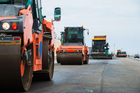 The road rollers working on the new road construction siteの写真素材