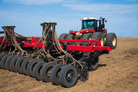Tractor during plowing. Agricultural tillage in springの写真素材