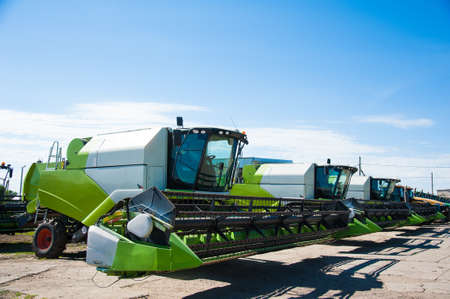 Combine harvesters, in a wheat field ready for harvestの写真素材