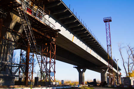 Unfinished old road bridge over the riverの写真素材
