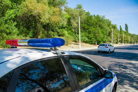 Police car during patrol service for patrolling city streetsの写真素材