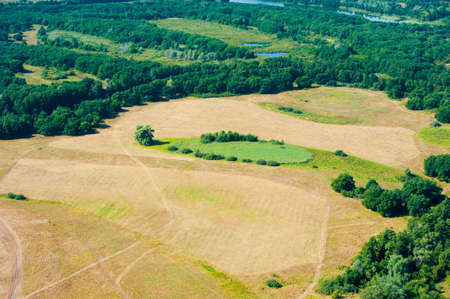 Aerial view of fields and meadows during a summer dayの写真素材