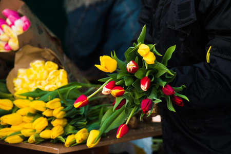 Flower market. Selling flowers. Bouquets of colorful tulipsの写真素材