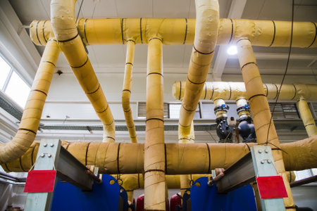 Closeup of manometer, pipes and faucet valves of heating system in an industrial boiler room. City heating systemの写真素材