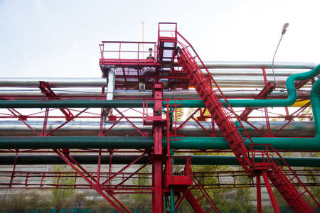 Steel pipelines, valves and ladders in an industrial enterprise. Industrial zoneの写真素材