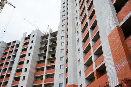 Multi-storey building. Construction of multi-storey residential buildingの写真素材
