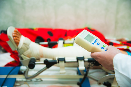 The hospital provides qualified assistance and care for patients with bandaged legsの写真素材