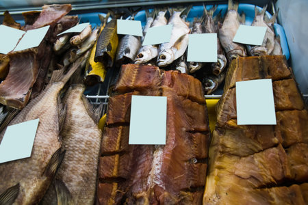 Smoked, fresh and salted fish is sold on the counter of the store
