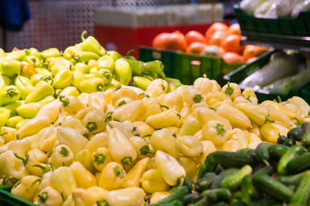 Bulgarian pepper in boxes is sold on the shelves of the vegetable marketの写真素材