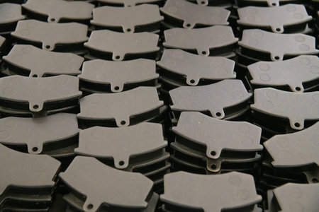 Storage of ready-made brake pads in the shop for their productionの写真素材