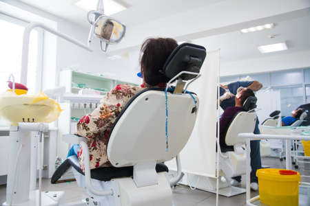 Woman receiving dental treatment. Dental clinic. Dental treatment. Dentist at workの写真素材