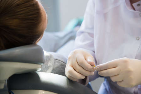 Woman receiving dental treatment. Dental clinic. Dental treatment. Dentist at workの写真素材