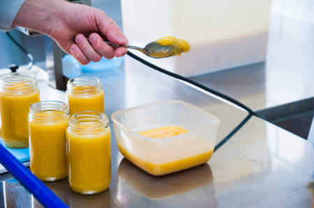 Jars full of organic honey. Production in factory